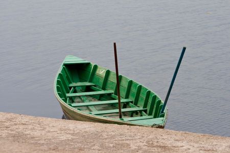 Green boat on the berth の写真素材