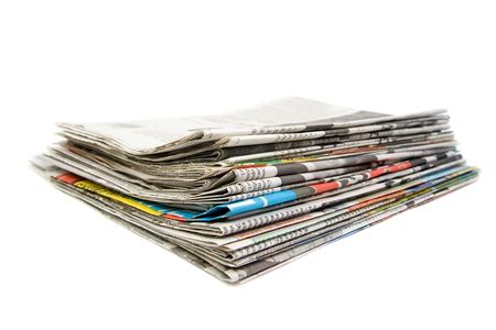Stack of newspapers. Isolated on white background. の写真素材