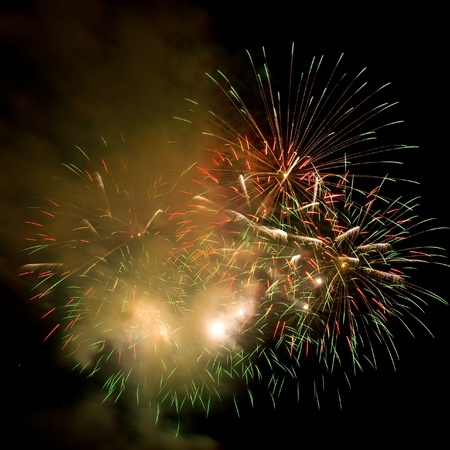 Volleys of beautiful fireworks in the night skyの写真素材