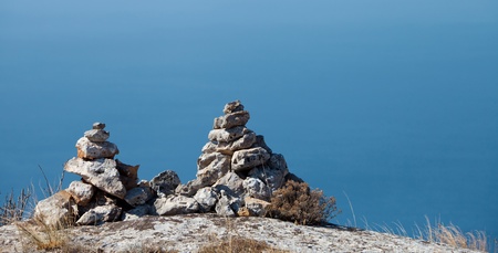 Two pyramids of stones against the blue skyの写真素材