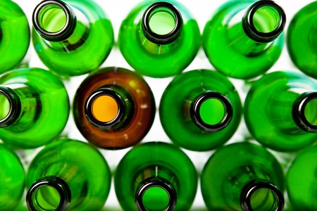 Beer bottles of green glass and a brown. Can be used as background の写真素材