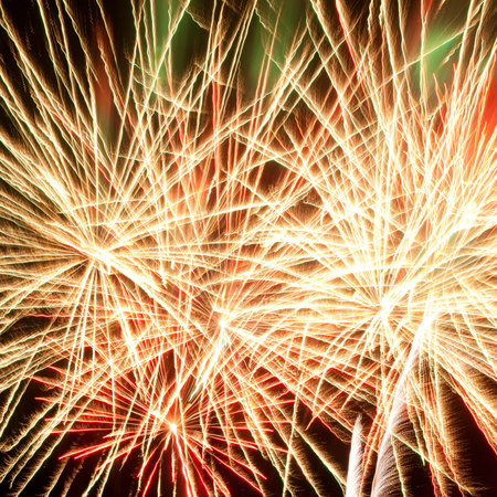 Volleys of beautiful fireworks in the night sky