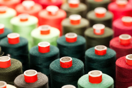 Background of the reels with colorful threads 