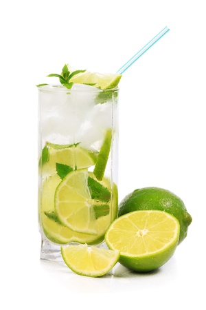 Mojito with lime, mint, ice and fruit near the glass. Isolated on white backgroundの写真素材