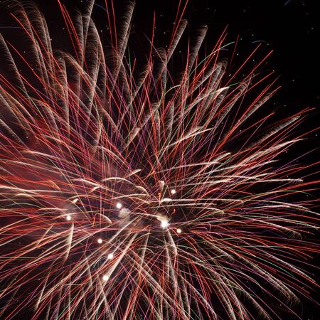 Beautiful red fireworks in the night skyの写真素材
