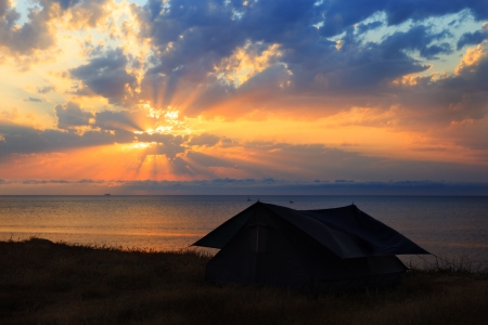 The tent on the seashore at sunsetの写真素材