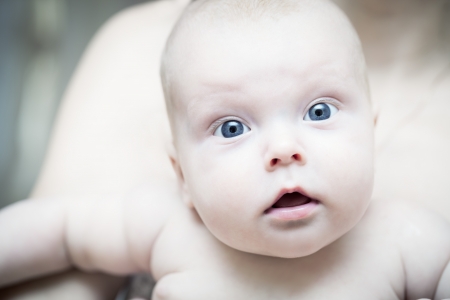 Portrait of a a small child with surprise on his faceの写真素材