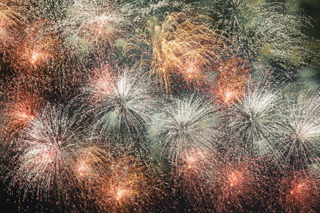 Colorful volleys fireworks in the night skyの写真素材