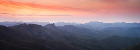 Colorful sunset over the mountain hills の写真素材