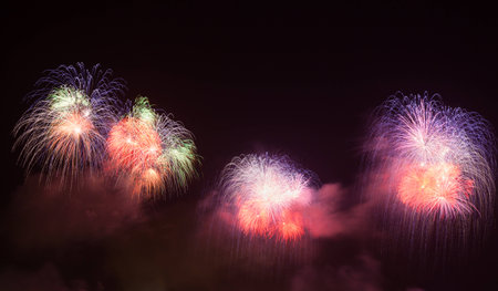 Outbreaks of fireworks in the night skyの写真素材