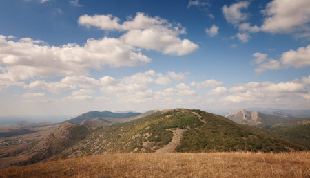 Landscape. Mountains under the blue sky with cloudsの写真素材