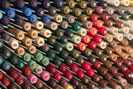Background of the reels with colorful threadsの写真素材