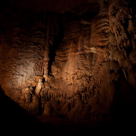 Stone columns, stalactites and stalagmites in a caveの写真素材
