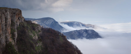 Landscape. The mountains tower over the clouds