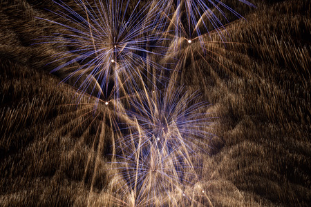Outbreaks of fireworks in the night skyの写真素材