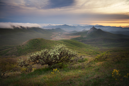 Landscape. Sunset over the mountains with cloudsの写真素材