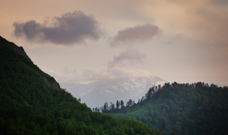 Landscape. Mountain ridges at against the sky with clouds. Caucasus, Russiaの写真素材