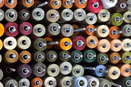 Background of the reels with colorful threadsの写真素材