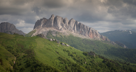 Caucasus mountains (Eastern and Western Acheshbok) under a blue sky with clouds. Caucasus, Russiaの写真素材