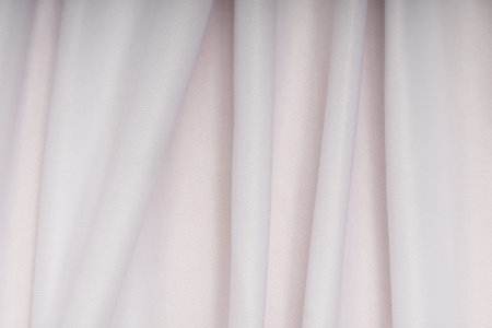 Background of white cloth with pink shade in the foldsの写真素材