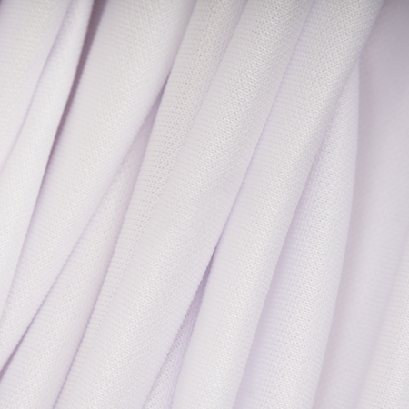 Background of white cloth with pink shade in the foldsの写真素材