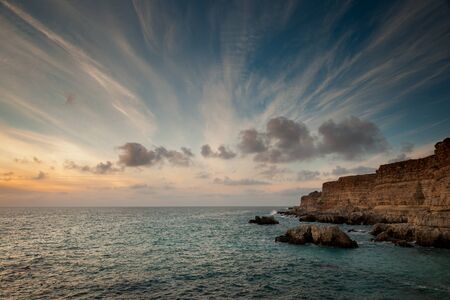 Seacoast with cliffs at sunset. Crimea.の写真素材