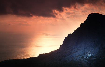 Small church under a mountain at sunset. Foros. Crimea.の写真素材