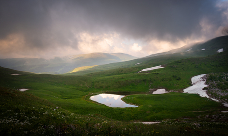 Lake Psenodah in the middle of alpine meadows in the mountains. Lago-Naki. Russiaの写真素材
