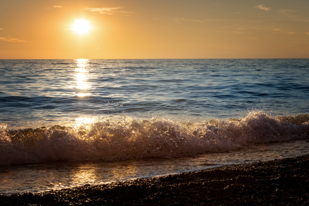 Seascape. Waves on the beach at sunsetの写真素材