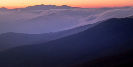 Landscape. Sunset over the mountains with cloudsの写真素材
