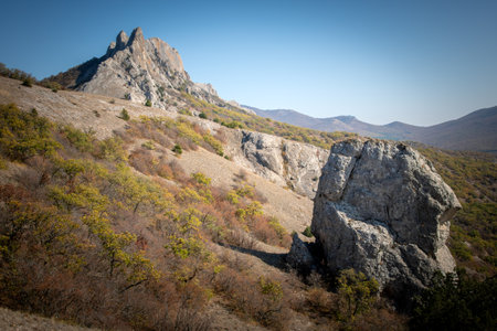 Landscape. Mountains and autumn forest under blue skyの写真素材