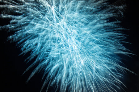 Beautiful blue fireworks in the night skyの写真素材