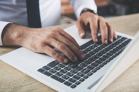 man hand computer keyboard on office deskの写真素材