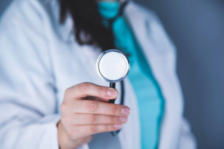 doctor hand stethoscope on the dark backgroundの写真素材