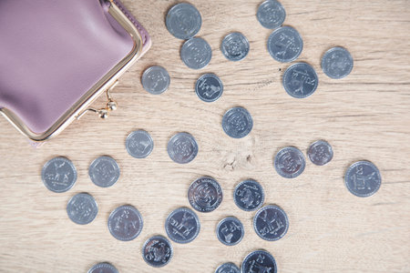 wallet with coins on the desk background