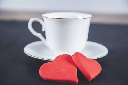 cup of coffee with red heart on deskの写真素材