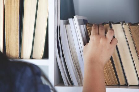 woman hand books in the office backgroundの写真素材