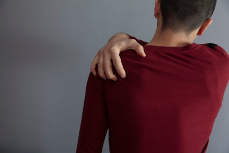 close up of man suffering from neck pain