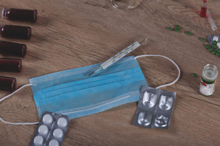 mask with drugs on the table background