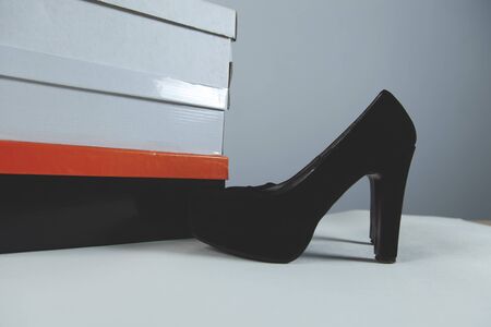 woman shoes with bag on white tableの写真素材