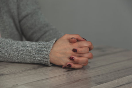 prayer woman hands on the desk background