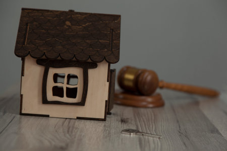 house model with judge on the wooden desk