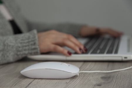woman working in computer keyboard on the deskの写真素材