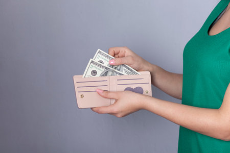 woman hand holding money with wallet