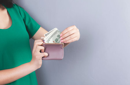 woman hand holding money with wallet