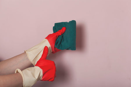 cleaner woman hand okay sign on pink backgroundの写真素材