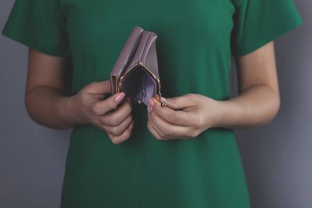 young woman hand holding black empty walletの写真素材