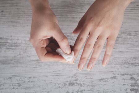 woman clean the nails on the table backgroundの写真素材