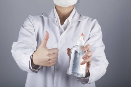  woman hand liquid gel and okay sign の写真素材