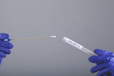 woman doctor hand swab and test tubeの写真素材